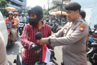 Polsek Metro Taman Sari Tebar Semangat Kemerdekaan Lewat 150 Bendera
