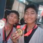 Foto: Dua atlet muda tampak tersenyum bangga sambil memperlihatkan medali yang mereka raih dalam ajang KONI Series 6 Indonesia Taekwondo Championship 2025.