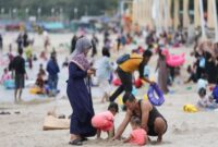 Foto: Ilustrasi Pengunjung Pantai Ancol. (Dok-Istimewa)